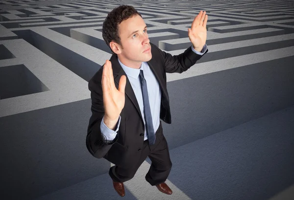 Composite image of businessman posing with arms raised