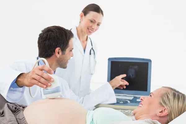 Pregnant blonde having an ultrasound scan
