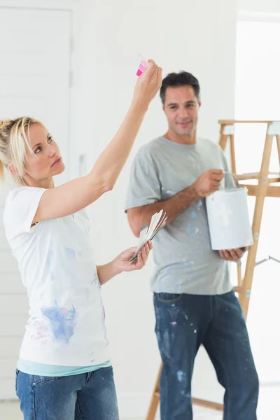 Couple with color swatches and ladder