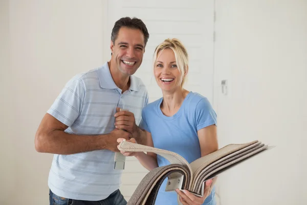 Couple with color book in new house