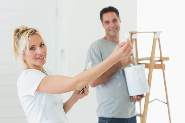 Couple with color swatches and ladder