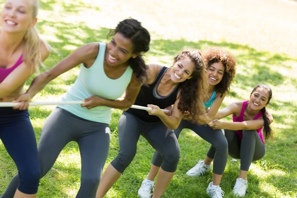 Women pulling a rope in tug of war