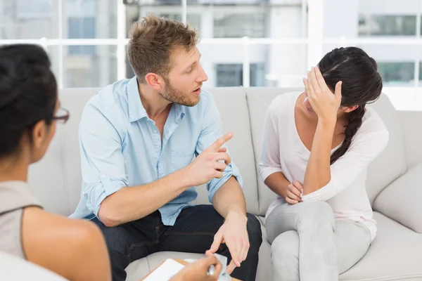 Couple fighting at therapy session