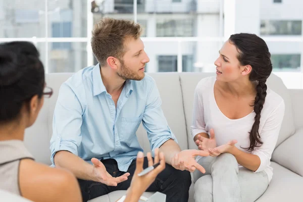 Couple arguing at therapy session