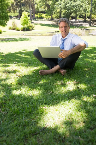 Confident businessman with laptop