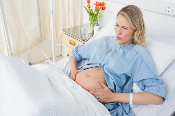 Expectant woman suffering from labor pains