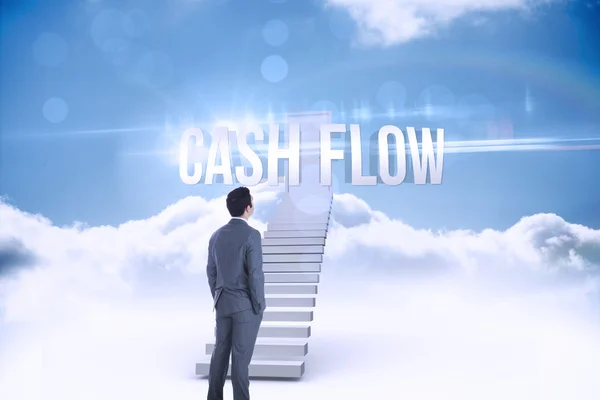 Cash flow against shut door at top of stairs in the sky