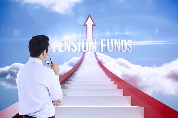 Pension funds against red steps arrow pointing up against sky