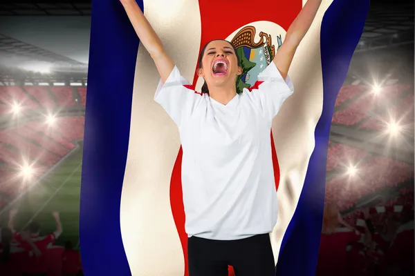 Football fan in white cheering holding costa  rica flag