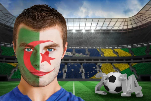 Composite image of serious young algeria fan with face paint