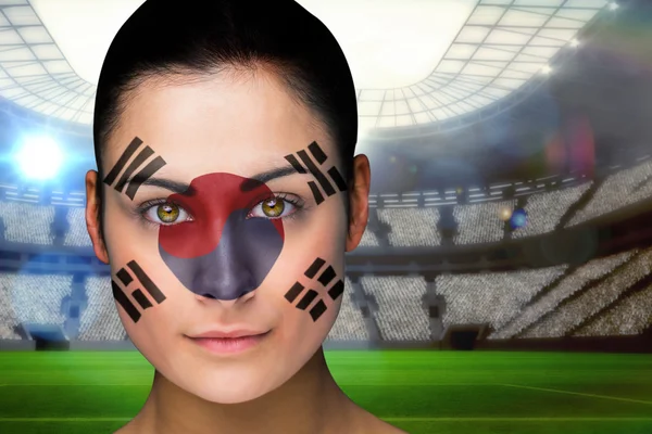 Composite image of beautiful korea fan in face paint