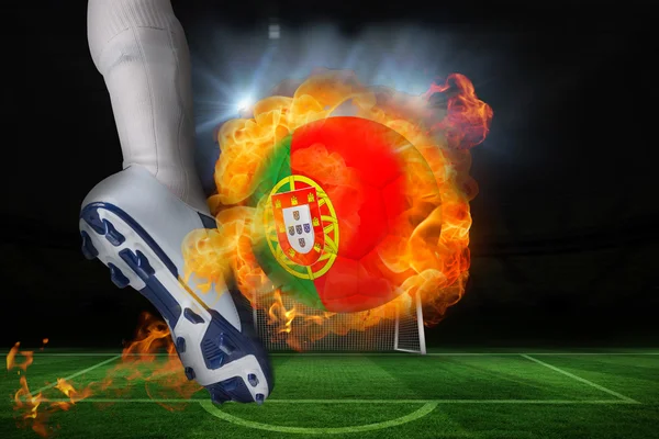 Football player kicking flaming portugal flag ball