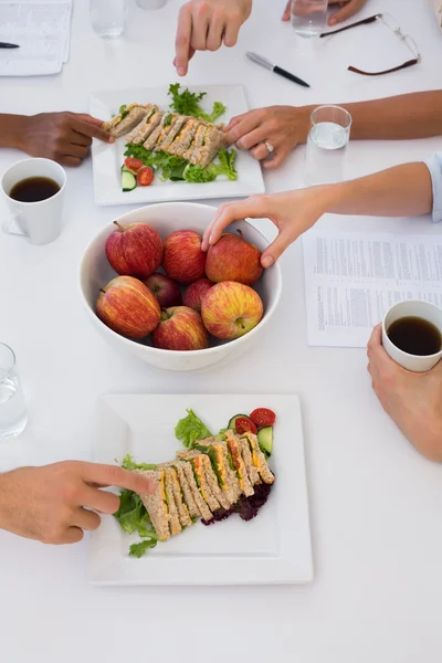 Workers eating healthy lunch