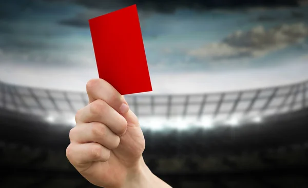 Hand holding up red card