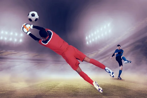 Goalkeeper in red making save