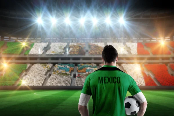 Mexico football player holding ball