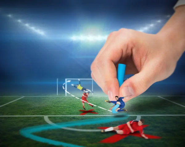 Hand drawing tactics on football pitch