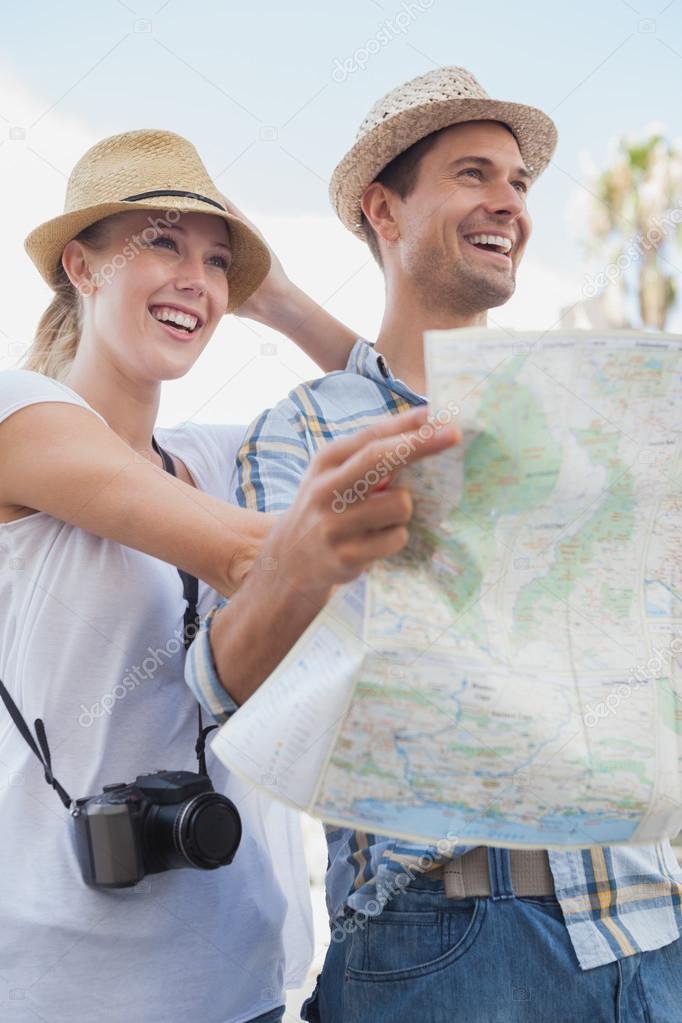 Lovely Tourist Couple Checking The Map Stock Photo And | tourist couple using the map stock photo Lovely Tourist Couple Checking The Map Stock Photo And | tourist couple using the map stock photo