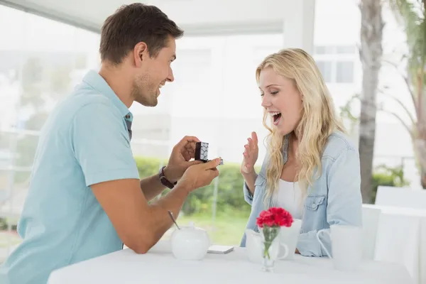 Man proposing marriage to his girlfriend