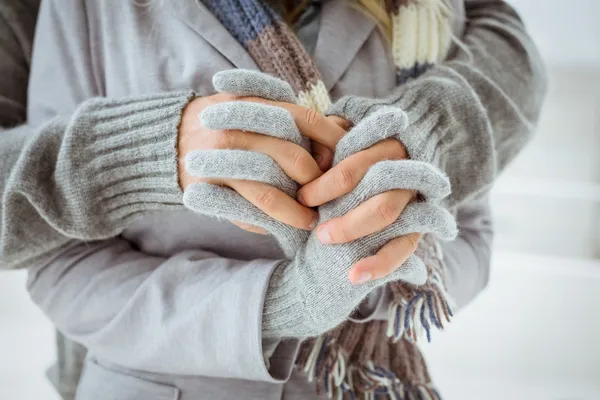 Couple in warm clothing holding hands