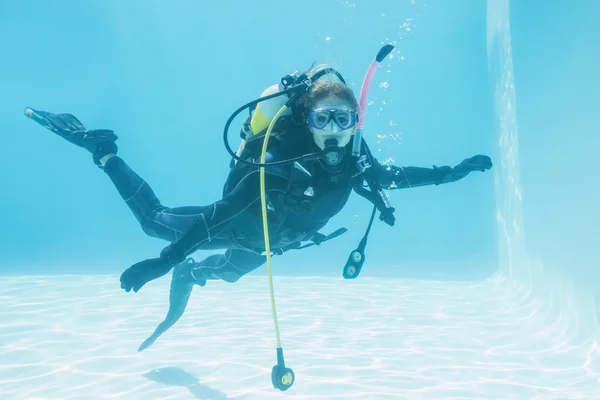 Woman on scuba training in swimming pool