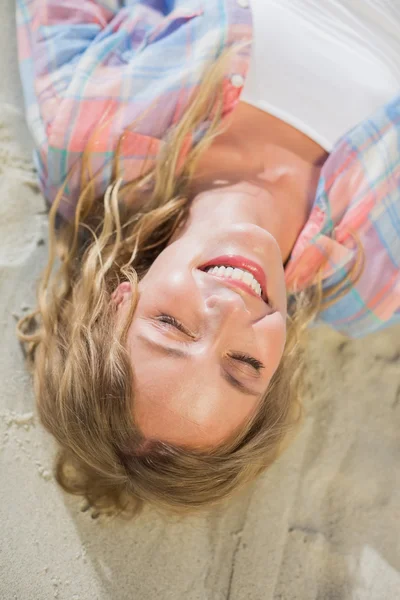 Blonde smiling at beach