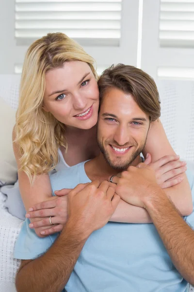 Couple on couch smiling
