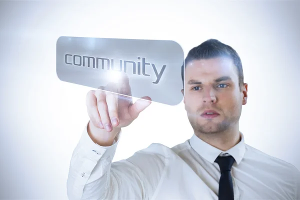 Businessman pointing to word community
