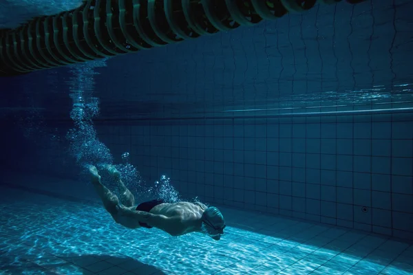 Fit swimmer training by himself