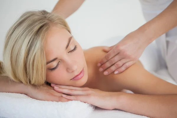 Pretty blonde enjoying a massage