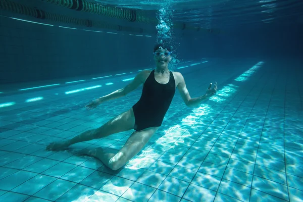 Athletic swimmer training on her own