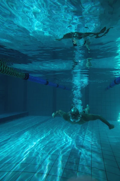 Fit swimmer training on his own