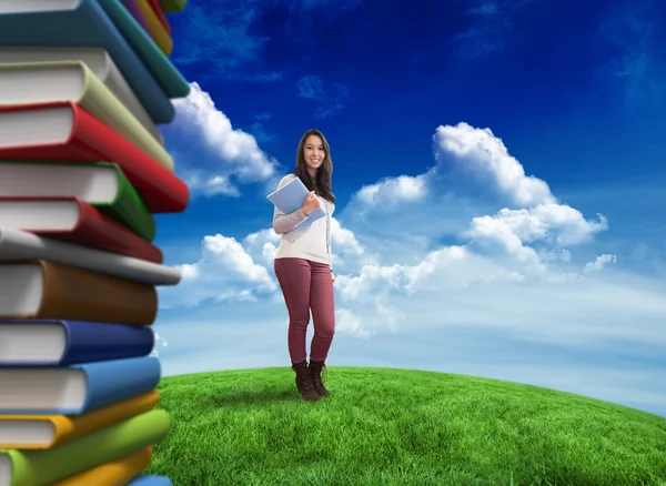 Student holding textbook