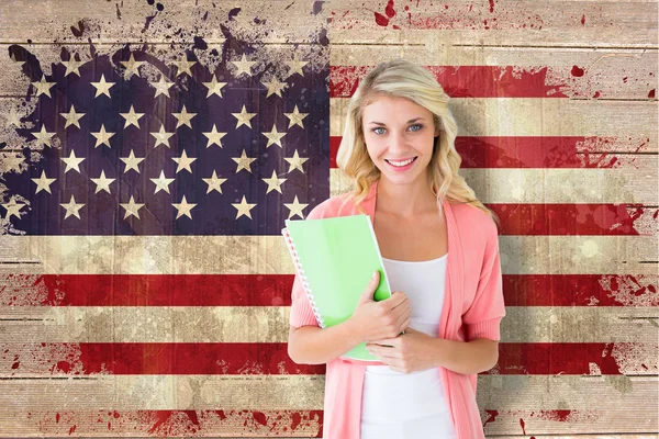 Student smiling against usa flag