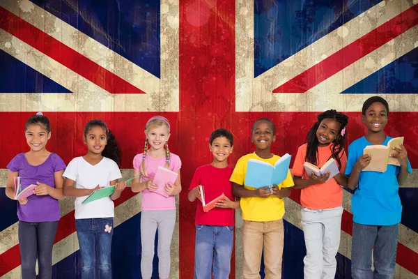 Pupils reading books against union jack flag