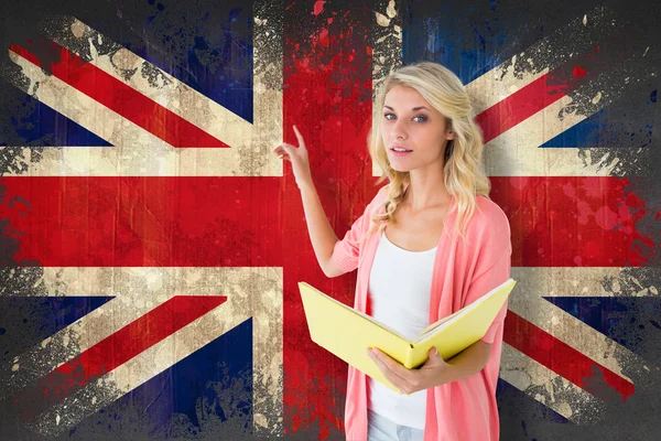 Student pointing against union jack flag