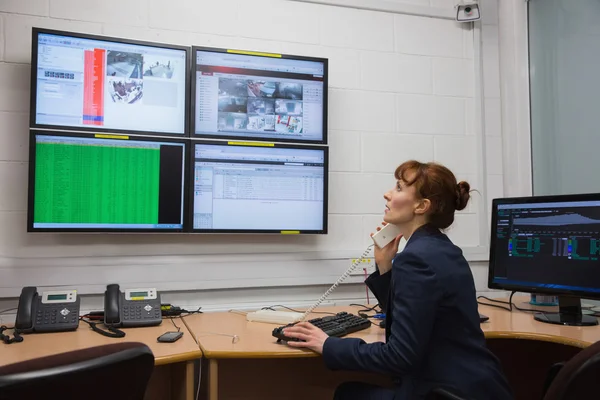 Technician sitting in office running diagnostics