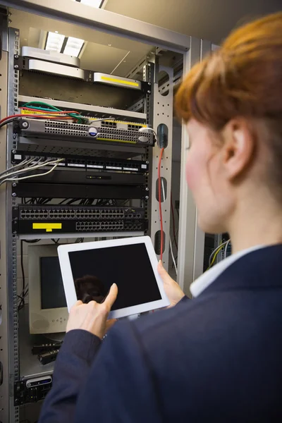 Pretty technician using tablet pc