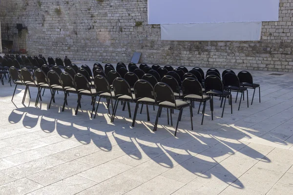 Outdoor cinema and raws of empty black seats in Zadar, Croatia