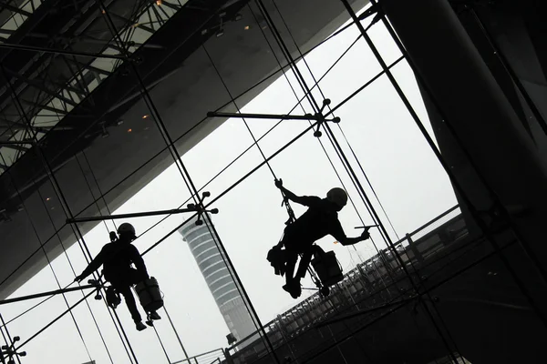 Window Cleaners (Window washers) working