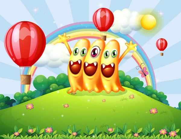 A hilltop with three happy monsters watching the floating balloo