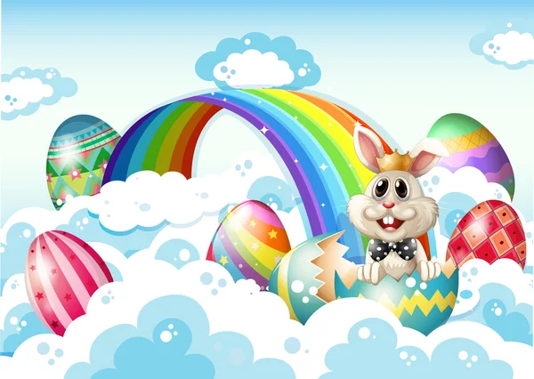 A king bunny at the sky with Easter eggs near the rainbow
