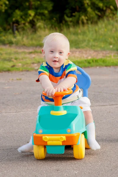Baby boy with Down syndrome driving — Stock Photo #12662841