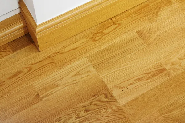 Laminate wooden flooring and skirting boards