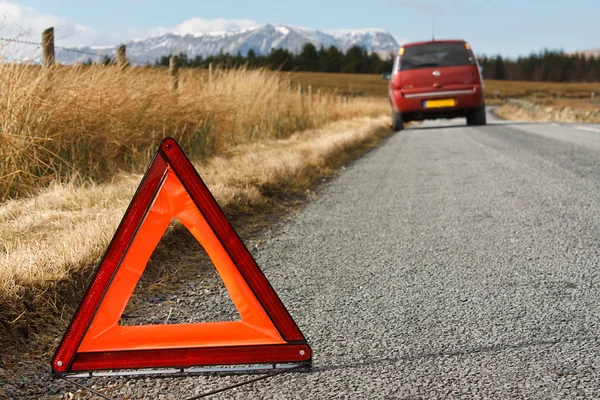 Broken down car with warning signal