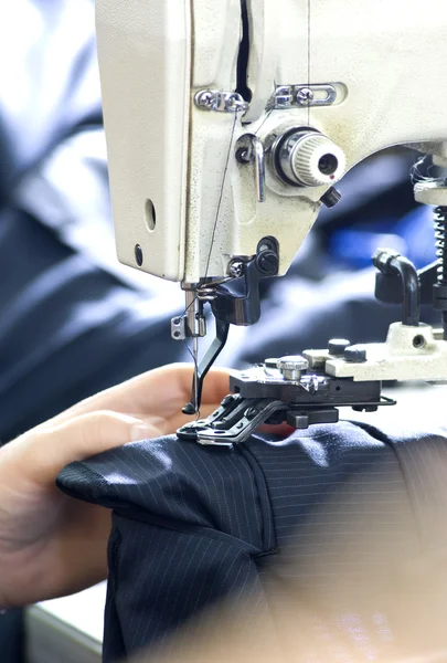 Tailor\'s hands sewing