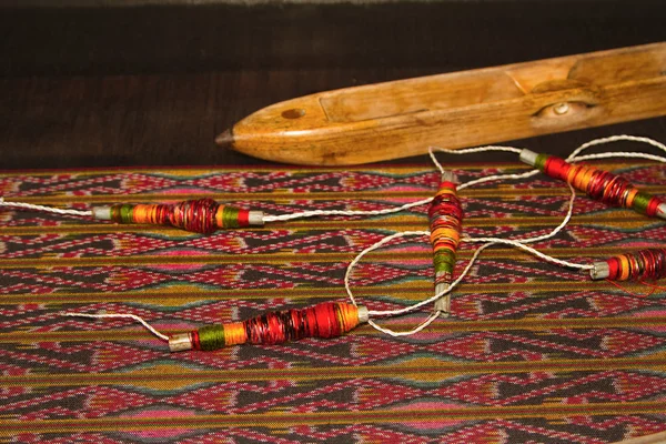 Spool of thread and wooden bobbin ,thai traditional cloth weavin
