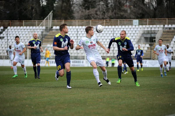 KAPOSVAR, HUNGARY - MARCH 16: Kink Tarmo (white 9) in action at a Hungarian Championship soccer game - Kaposvar (white) vs Puskas Akademia (blue) on March 16, 2014 in Kaposvar, Hungary.