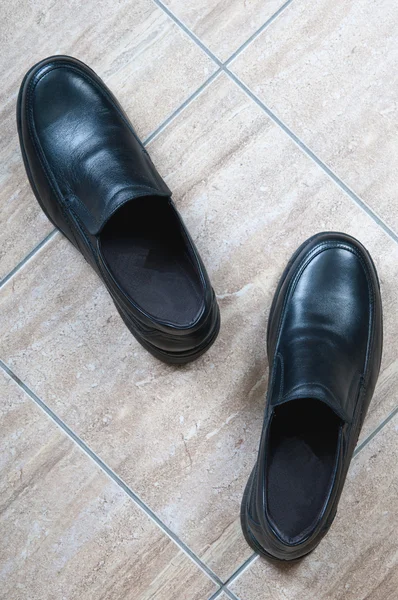 A pair of black leather shoe for man