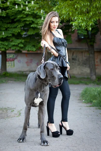 Beautiful woman with a large dog